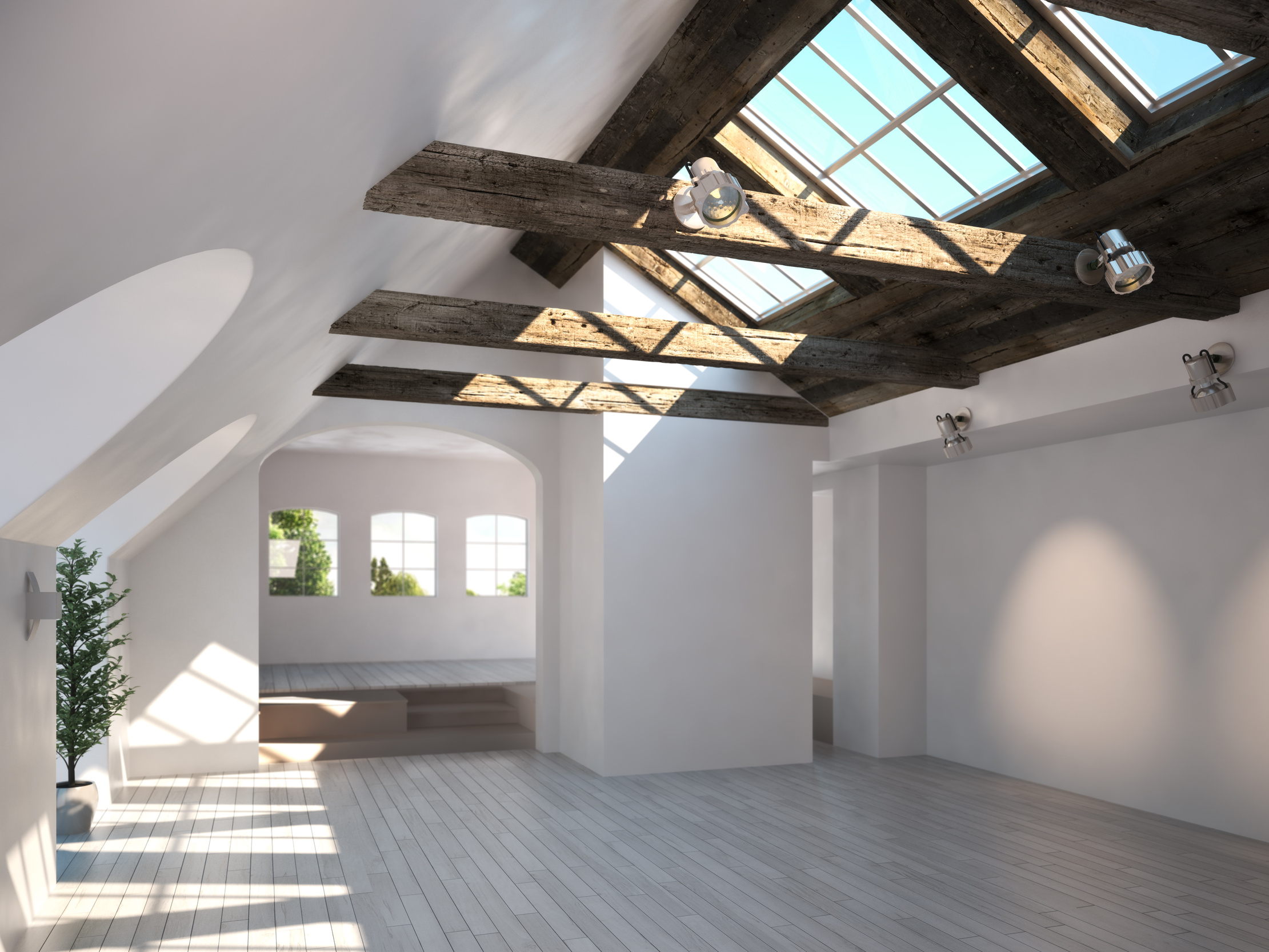 Empty room with rustic timber ceiling and skylights